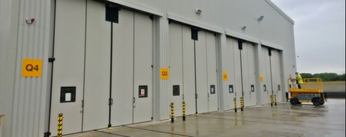 Puerta de hangar plegable - SWT-SEW - JEWERS DOORS - industrial / automática