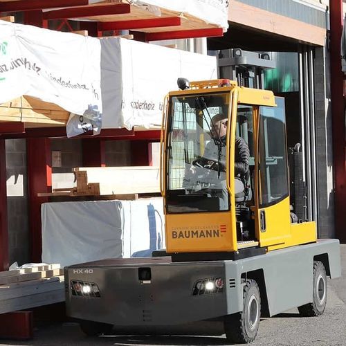 Chariot élévateur diesel - HX series - Baumann Srl - à conducteur porté assis / à 4 roues / latéral