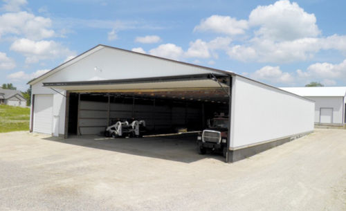 Porte de hangar coulissante - Bi-Fold  - HI-FOLD DOOR CORPORATION - pliante / automatique