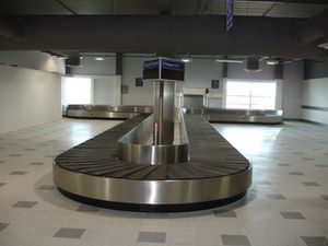 half moon baggage claim carousel