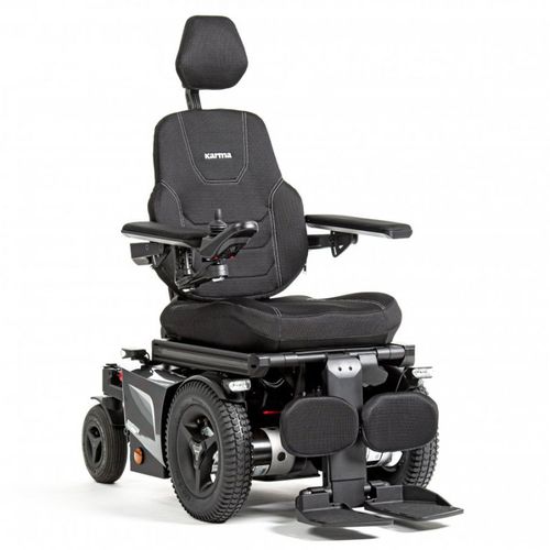 Power wheelchair user at airport