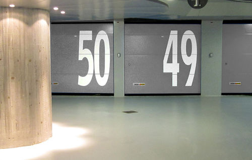 Sectional hangar door - KOPRON - roll up / automatic