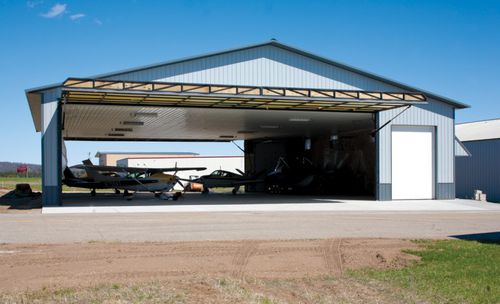 Porta per hangar battente - No-Fold  - HI-FOLD DOOR CORPORATION - per aereo / automatica